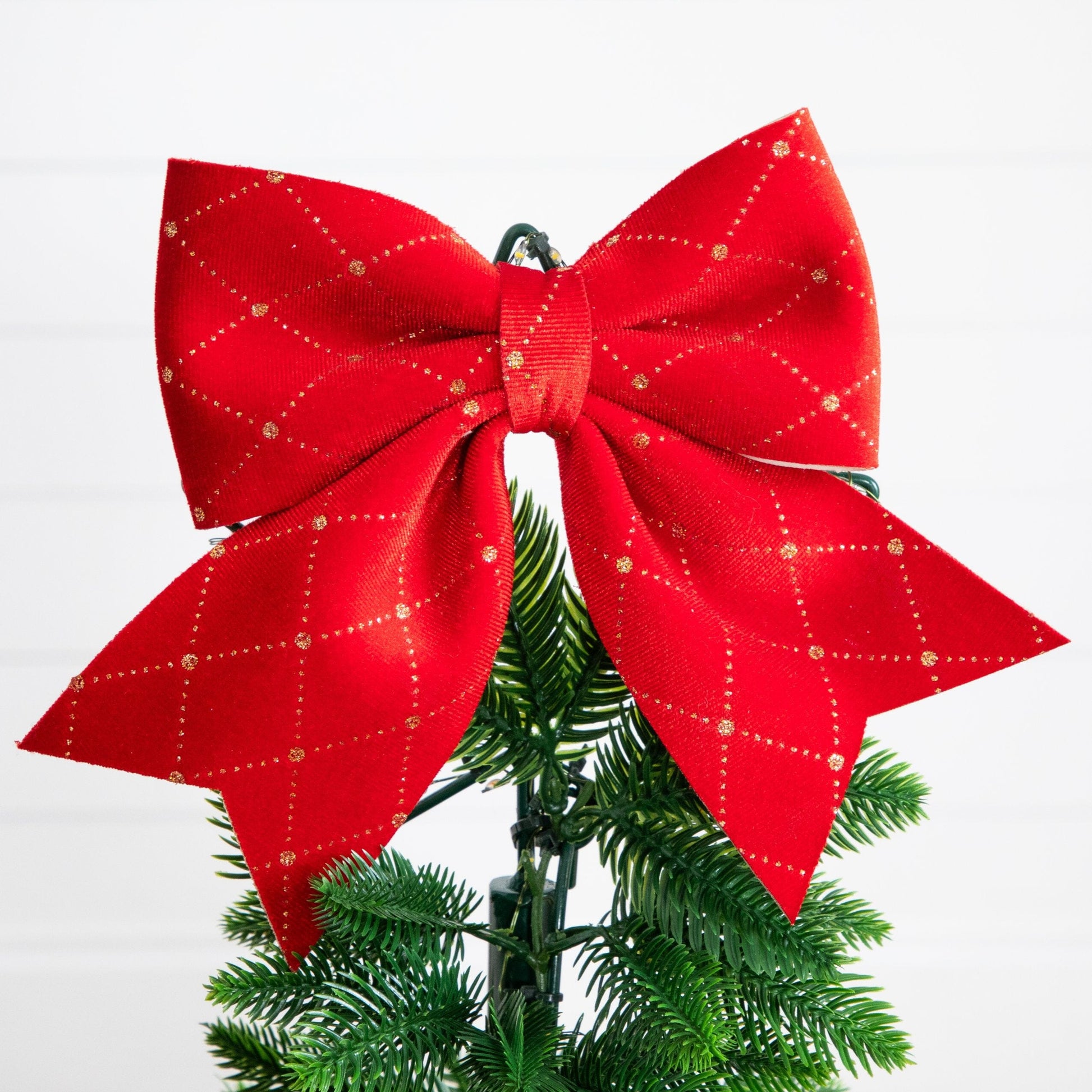 Christmas tree Nearly Natural red bow topper with gold glitter on UV resistant pre-lit tree on Tampa Home & Garden Store