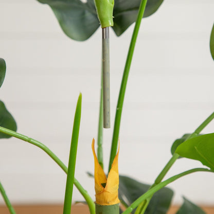 3.5' artificial Monstera tree with green stems, visible leaves, and yellow trunk wrap on Tampa Home & Garden Store