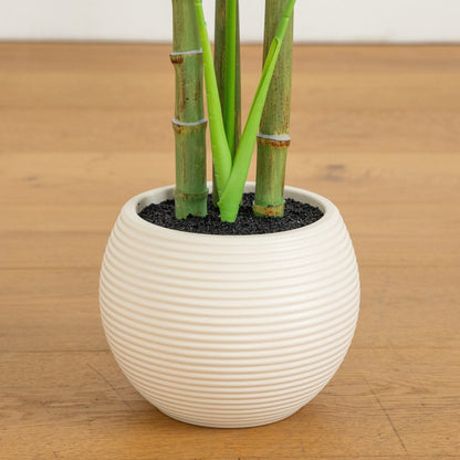 3.5' artificial monstera tree in a white ribbed round planter with dark soil on Tampa Home & Garden Store