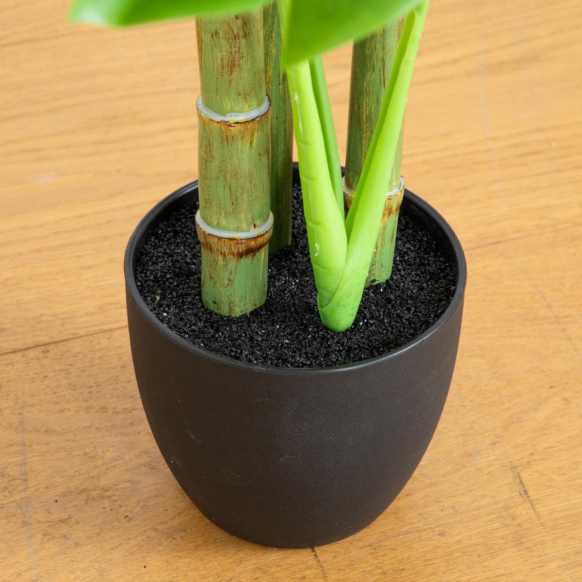3.5' artificial Monstera tree in black pot with green bamboo-like stalks on Tampa Home & Garden Store