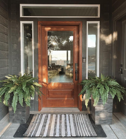 35” Boston Fern artificial plant set of 2 in dark gray ribbed planters beside a front door on Tampa Home & Garden Store