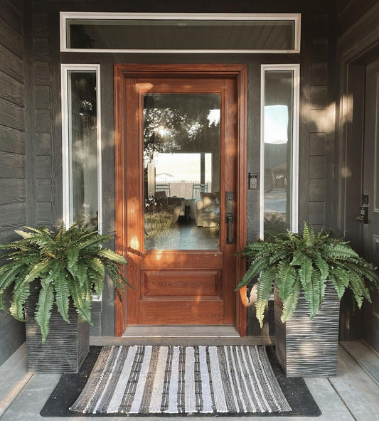 35” Boston Fern artificial plant set of 2 in dark gray ribbed planters beside a front door on Tampa Home & Garden Store