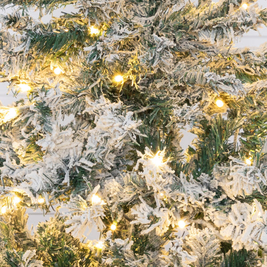4ft flocked Rock Springs Spruce Christmas tree with 100 clear LED lights by Nearly Natural on Tampa Home & Garden Store