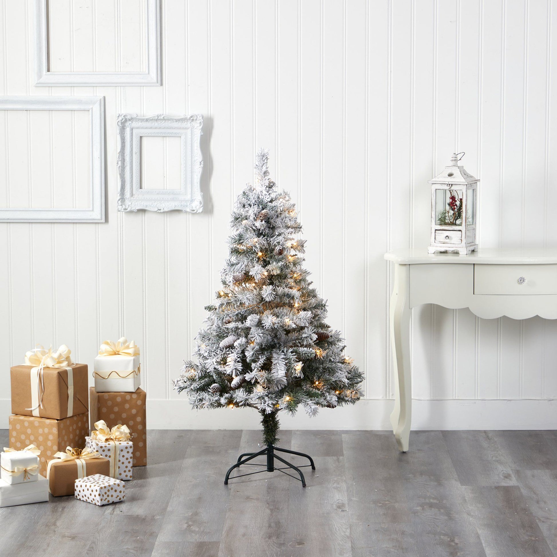 4' flocked white pine artificial Christmas tree with pinecones and 100 clear LED lights on Tampa Home & Garden Store