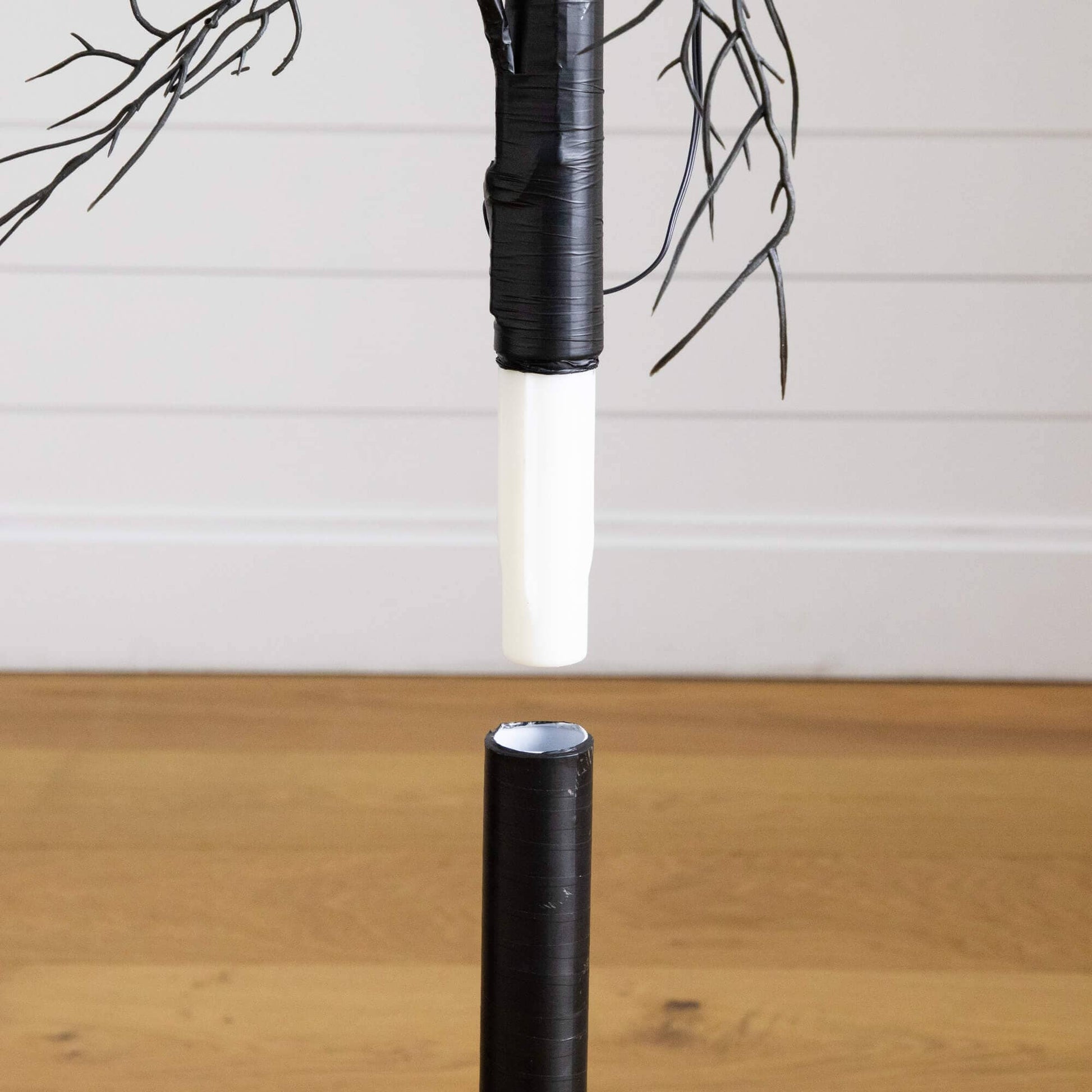 4' Pre-Lit Artificial Halloween Black Twig Tree with wrapped black trunk and bare branches on Tampa Home & Garden Store