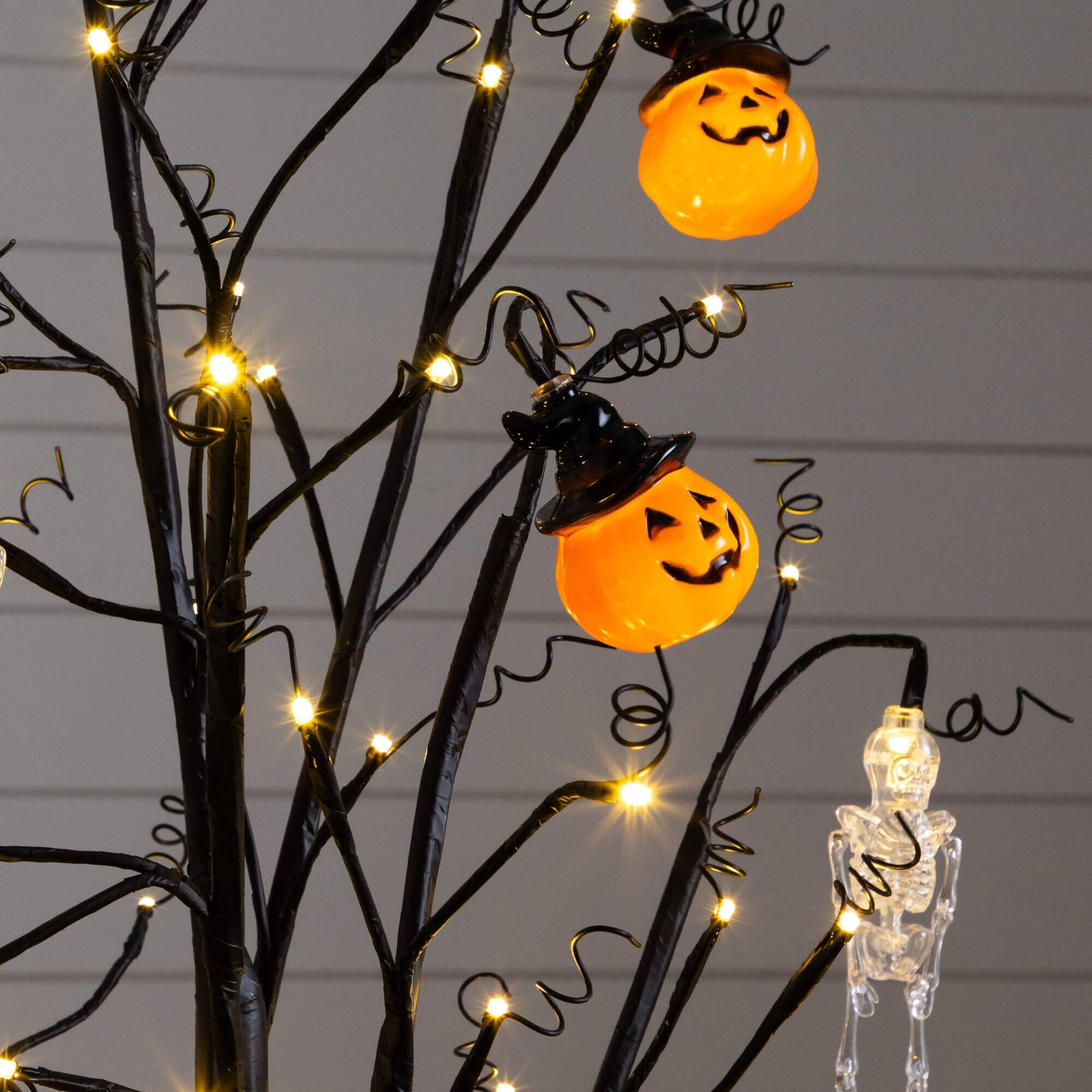4 ft Nearly Natural pre-lit Halloween ornament tree with orange pumpkins and skull accents, 64 warm white LEDs on Tampa Home & Garden Store