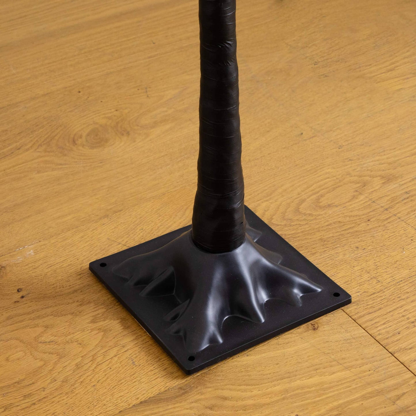 Nearly Natural 4' pre-lit ornament tree trunk with black wrap and square base on wood floor on Tampa Home & Garden Store