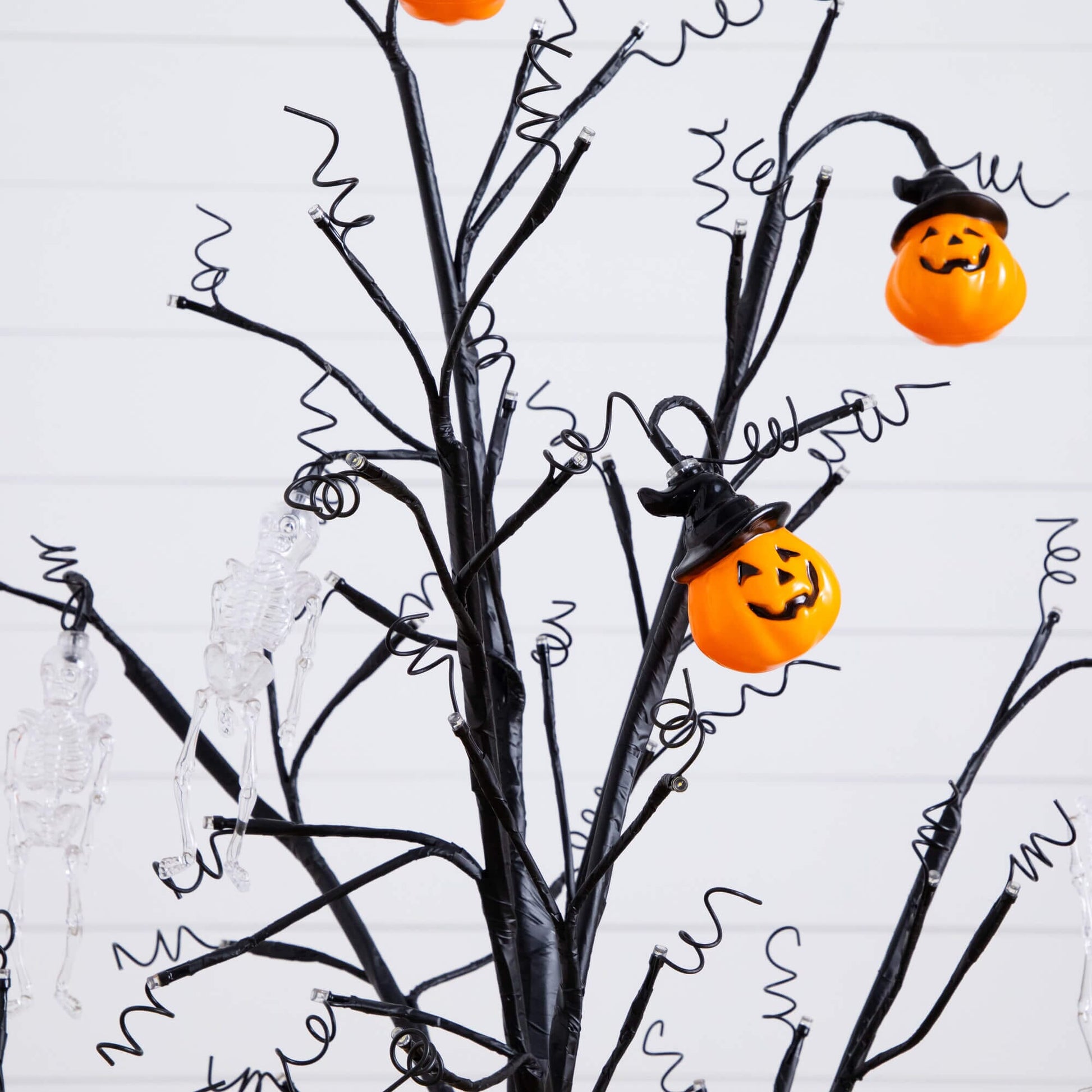 4' Pre-Lit Halloween Pumpkin & Skull Ornament Tree with 2 orange pumpkins and black branches on Tampa Home & Garden Store