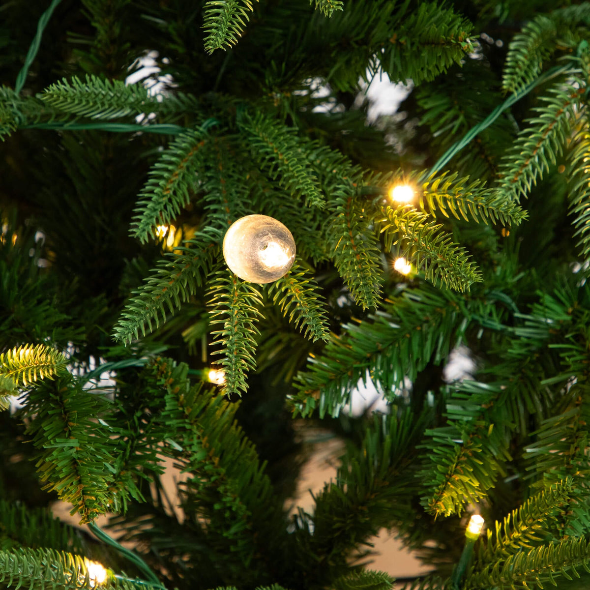 4' Nearly Natural Luxembourg Pine tree, pre-lit with warm white LED bulbs on green branches on Tampa Home & Garden Store