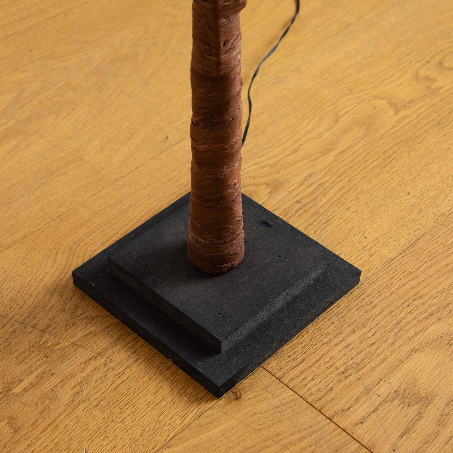 4' autumn artificial tree trunk by Nearly Natural with brown bark wrap and black base on Tampa Home & Garden Store