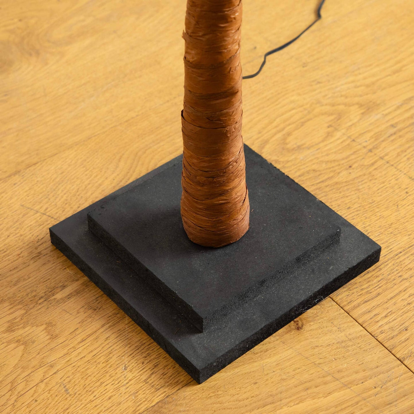 Tree 4 ft Nearly Natural maple trunk wrapped in brown bark on a black base with cord on Tampa Home & Garden Store