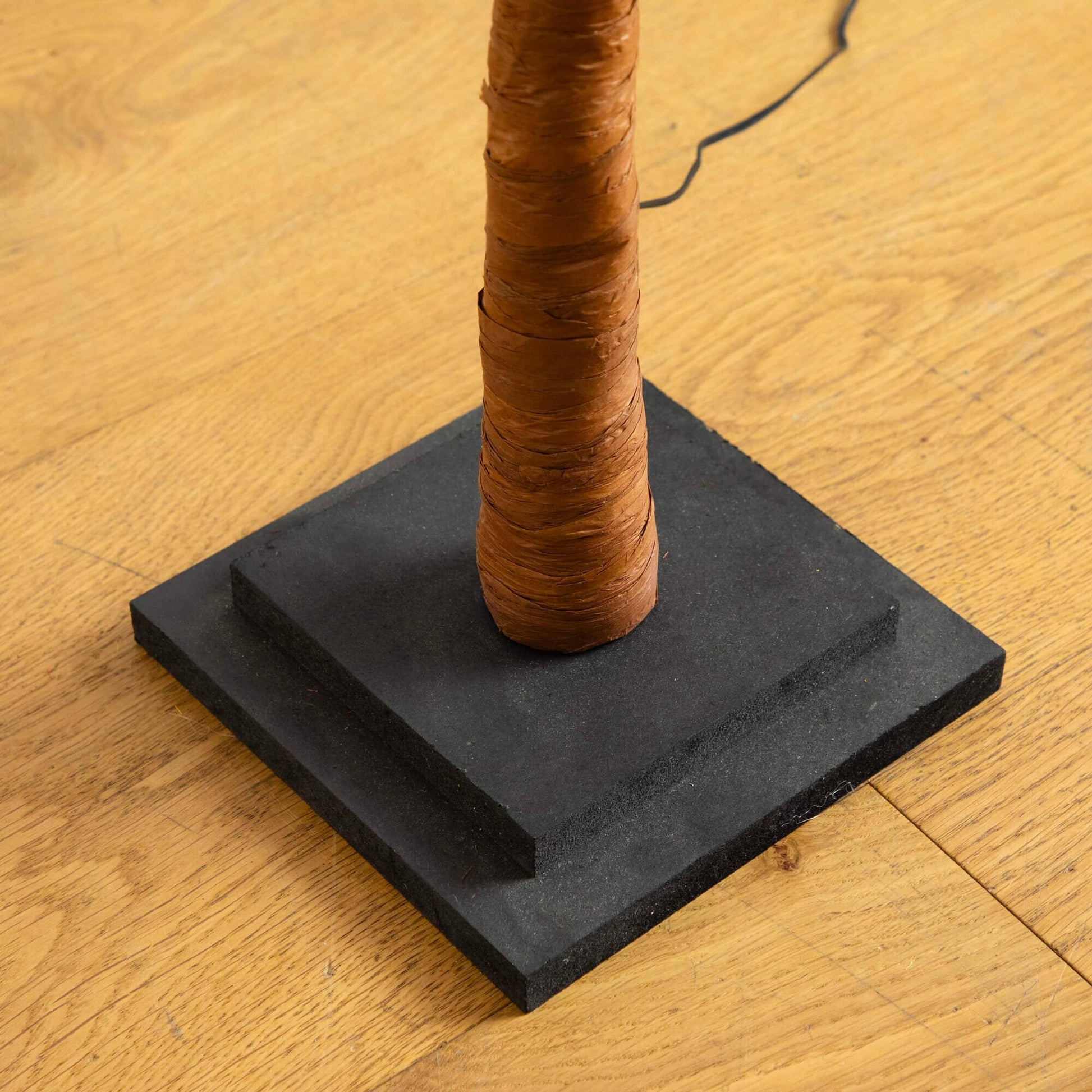 Tree 4 ft Nearly Natural maple trunk wrapped in brown bark on a black base with cord on Tampa Home & Garden Store