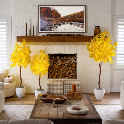 Two 4-ft yellow autumn maple artificial trees with warm white LEDs by fireplace mantel on Tampa Home & Garden Store