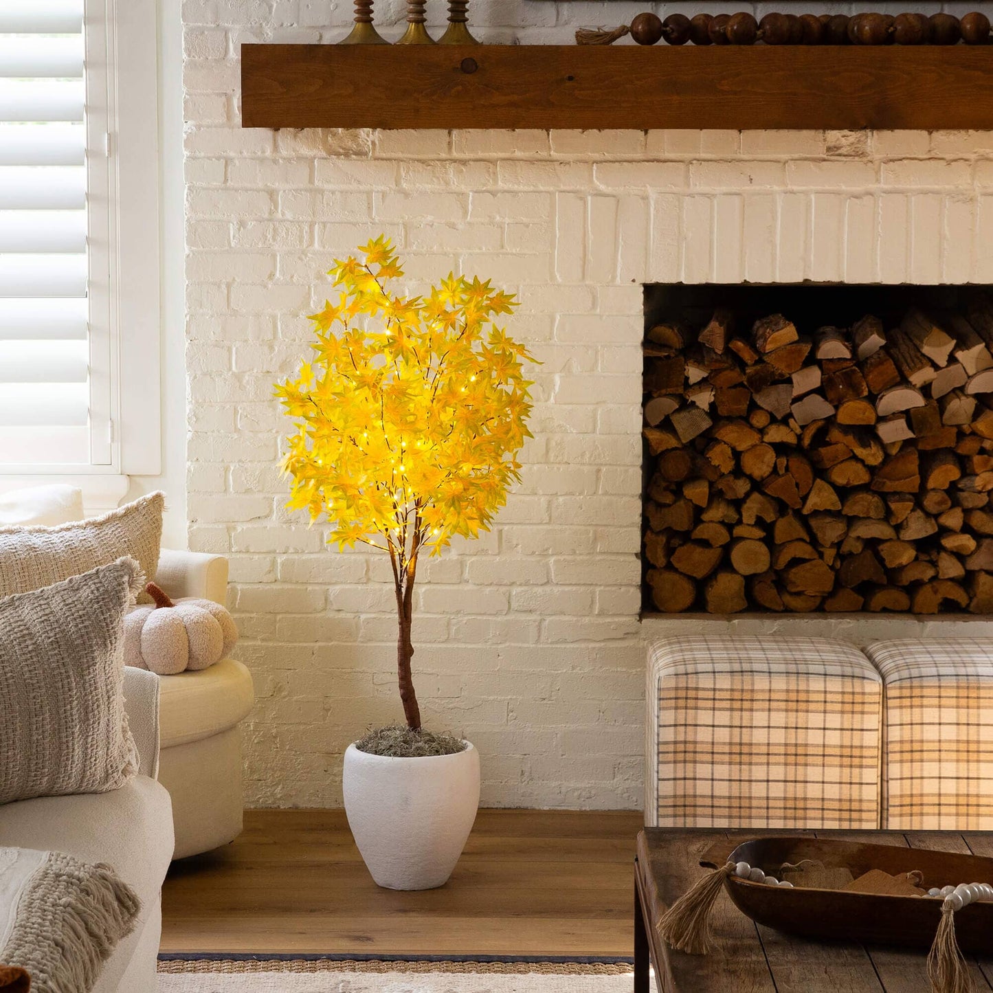 4' Pre-Lit Yellow Autumn Maple artificial tree with 150 warm white LEDs in pot by a fireplace on Tampa Home & Garden Store