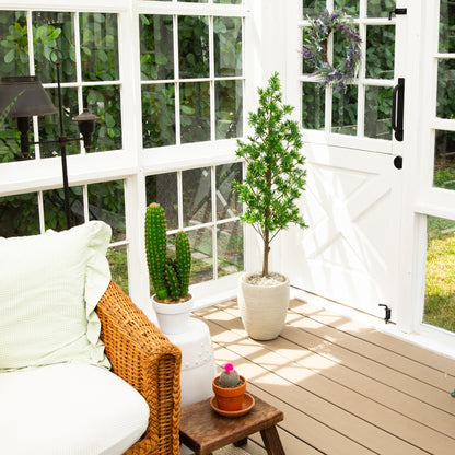 4 ft UV artificial Podocarpus tree with green leaves in a white pot on a deck beside glass doors on Tampa Home & Garden Store