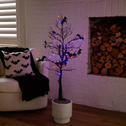 4 ft black Halloween twig tree with bats and orange-purple LED lights in white planter on Tampa Home & Garden Store