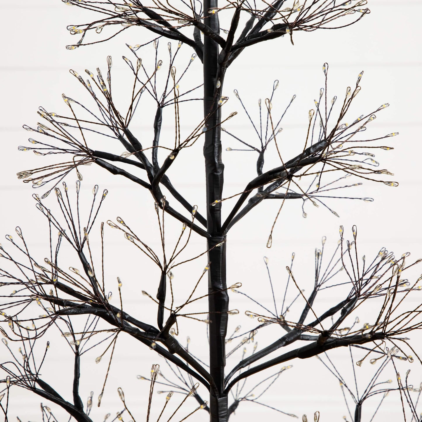 4ft Pre-Lit Halloween Black Starburst Tree with 800 warm white LEDs Nearly Natural on Tampa Home & Garden Store