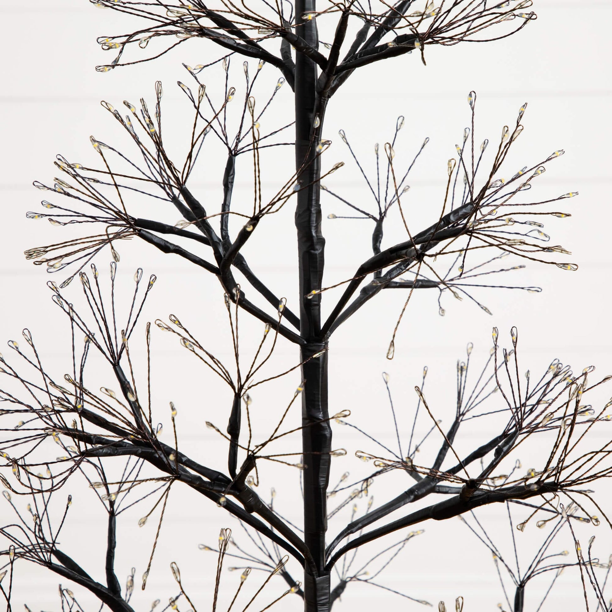 4ft Pre-Lit Halloween Black Starburst Tree with 800 warm white LEDs Nearly Natural on Tampa Home & Garden Store
