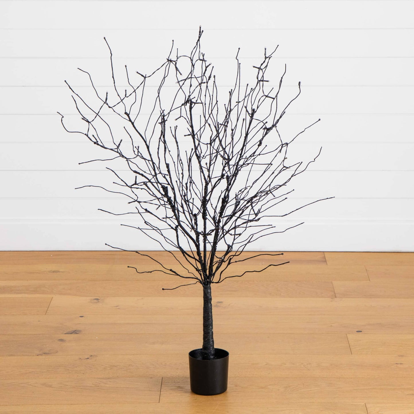 4 ft black twig Halloween tree with 50 orange LED lights in a black pot from Nearly Natural on Tampa Home & Garden Store