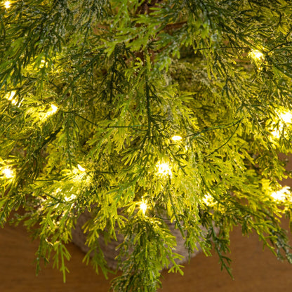 4 ft pre-lit artificial snowed cypress tree close-up with green needles and warm LEDs on Tampa Home & Garden Store