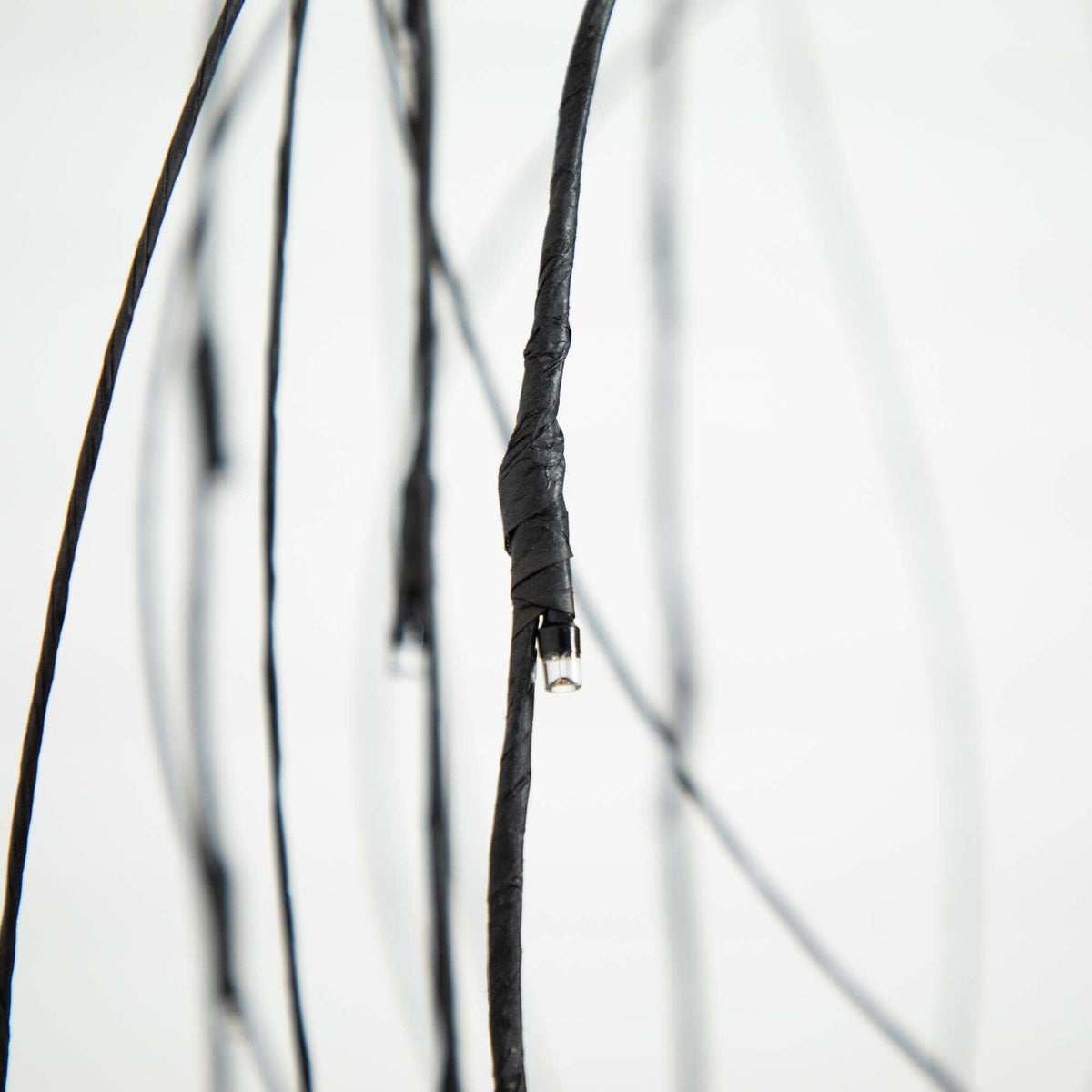Tree Nearly Natural 4’ Pre-Lit Halloween Black Willow wiring close-up with a small LED bulb on Tampa Home & Garden Store