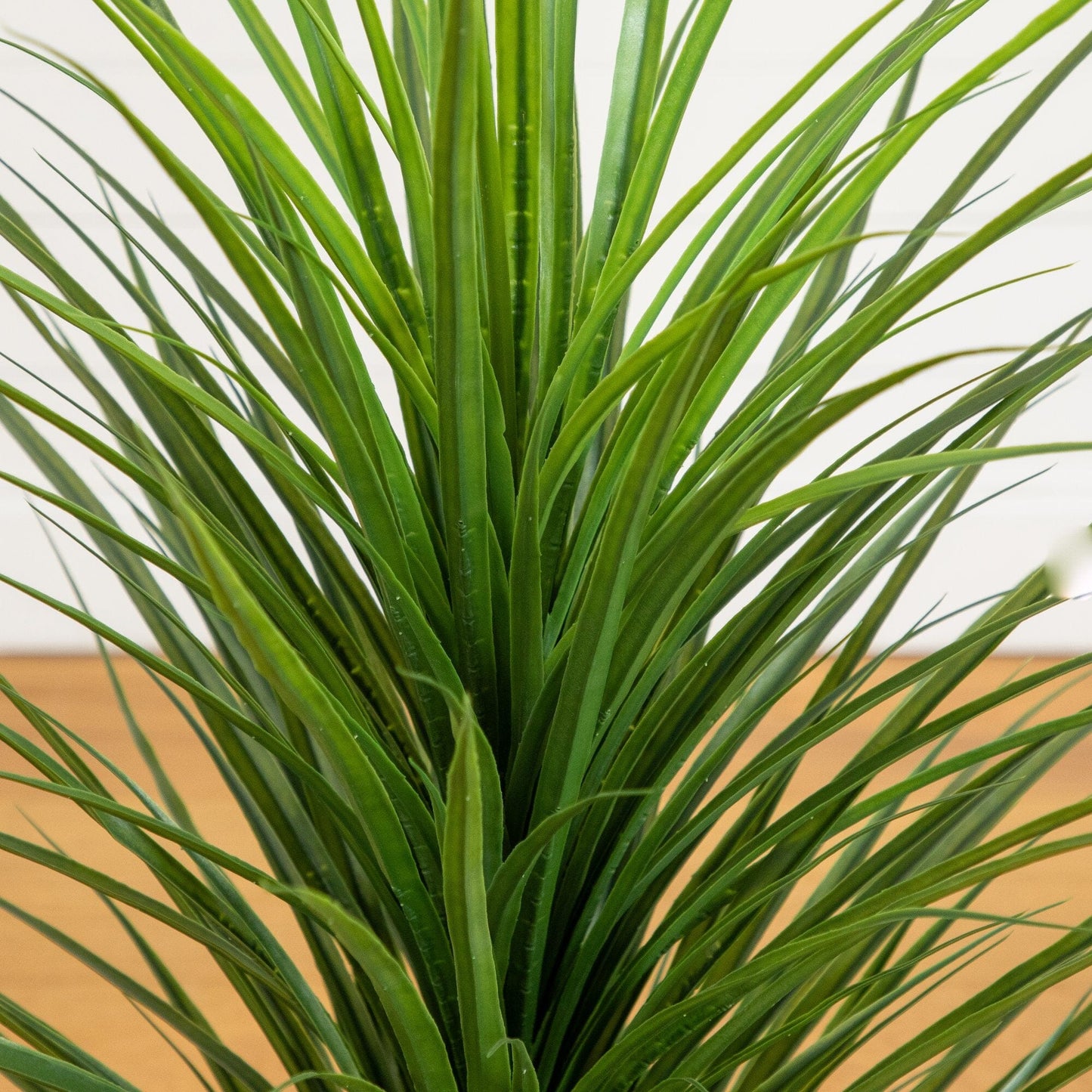 4 ft UV-resistant artificial grass plant by Nearly Natural with green blades in a planter on Tampa Home & Garden Store