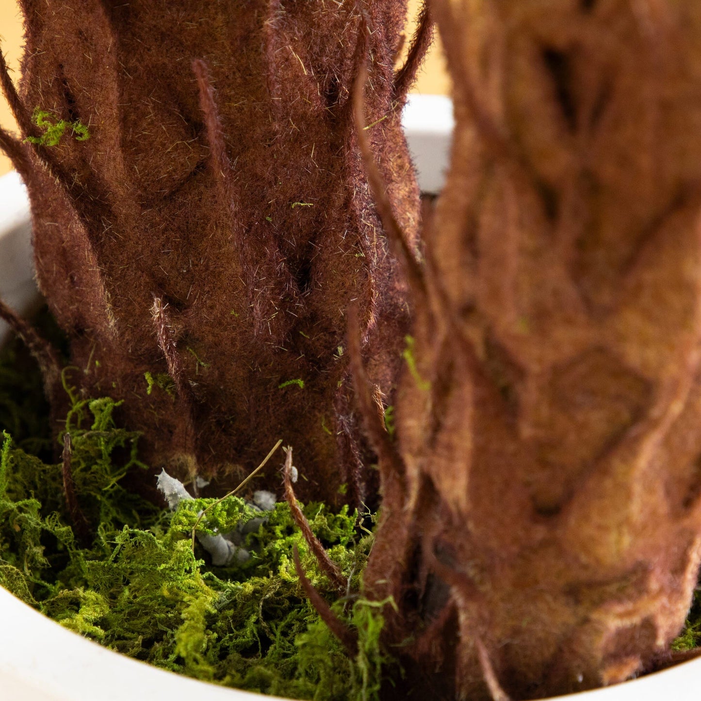 Artificial Double Cycas Palm Tree trunk close-up with brown textured surface and green moss on Tampa Home & Garden Store