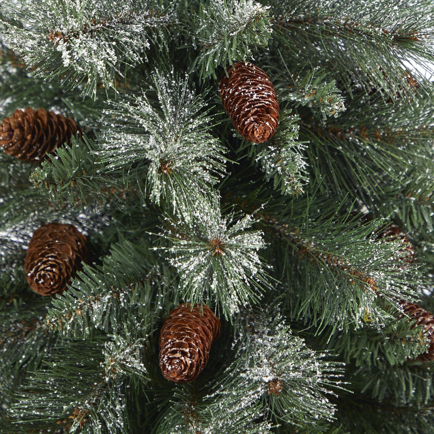 Christmas tree branches from Nearly Natural with snow-dusted needles and pine cones on Tampa Home & Garden Store