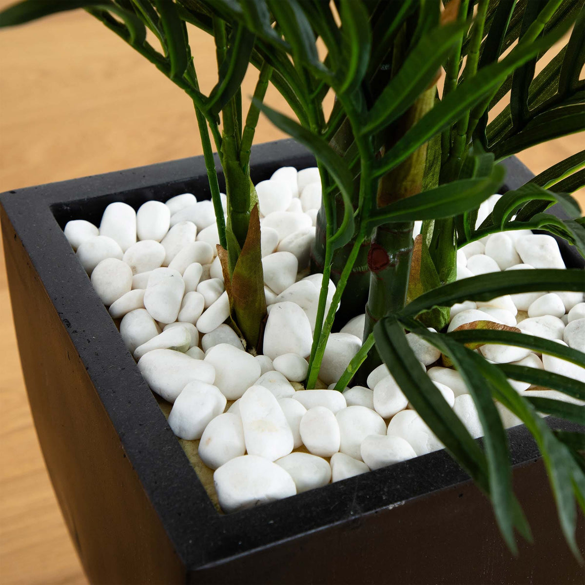 4.5 ft Nearly Natural Areca Palm tree in black wash planter with white rocks on Tampa Home & Garden Store