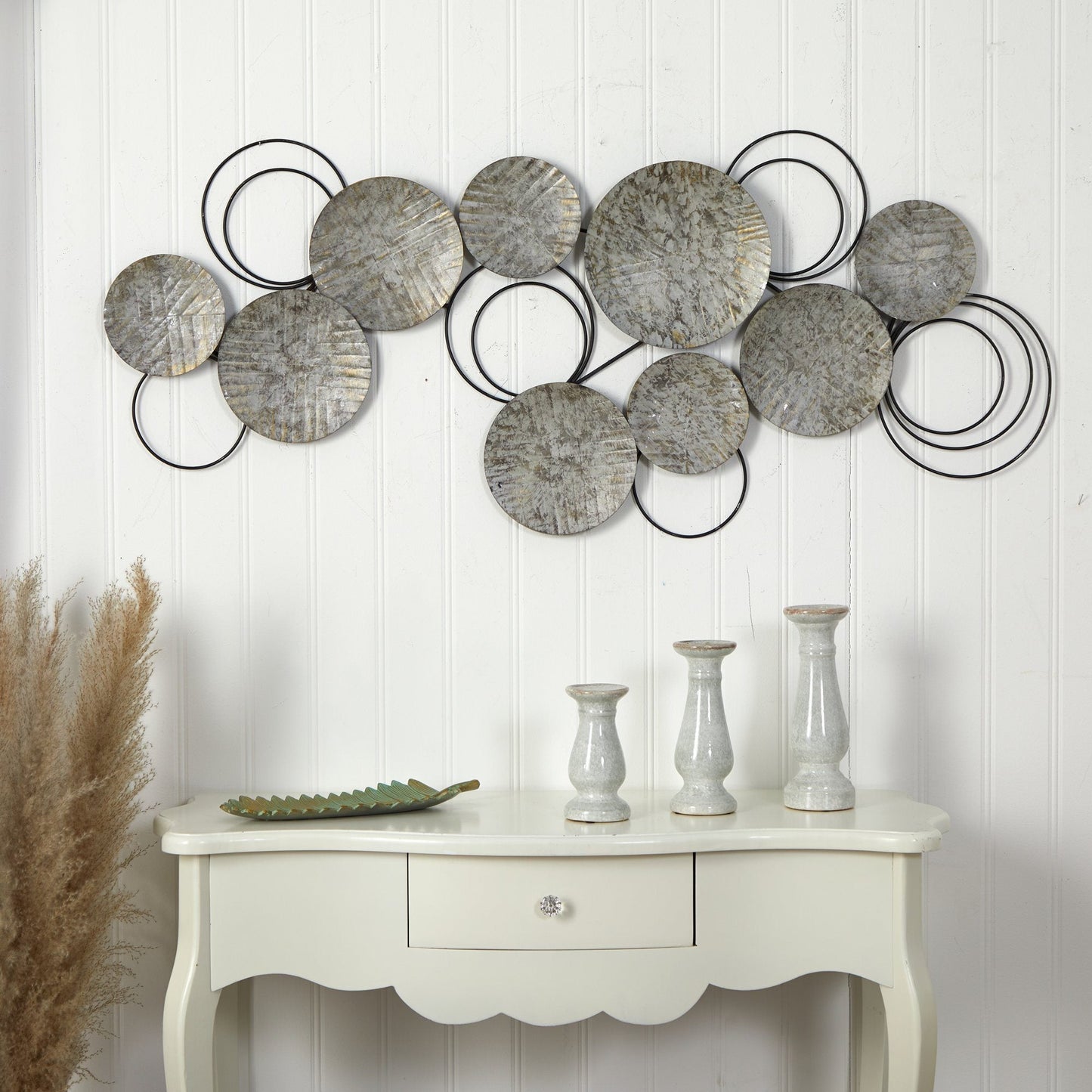 Galvanized embossed metal discs wall art by Nearly Natural; circles linked by black rings on Tampa Home & Garden Store