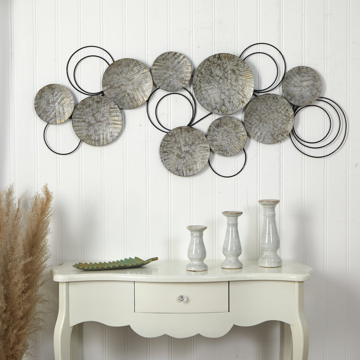 Galvanized embossed metal discs wall art by Nearly Natural; circles linked by black rings on Tampa Home & Garden Store