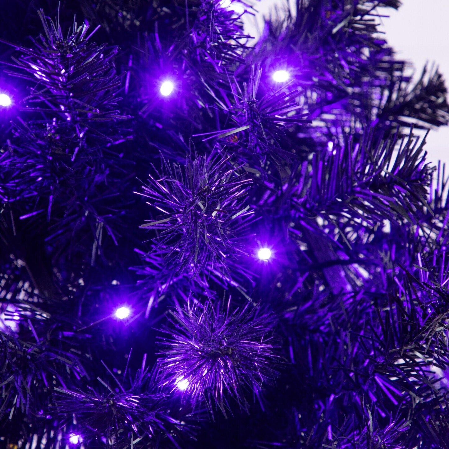4 ft pre-lit Halloween tree with purple and orange LEDs and a black moon skull design on Tampa Home & Garden Store