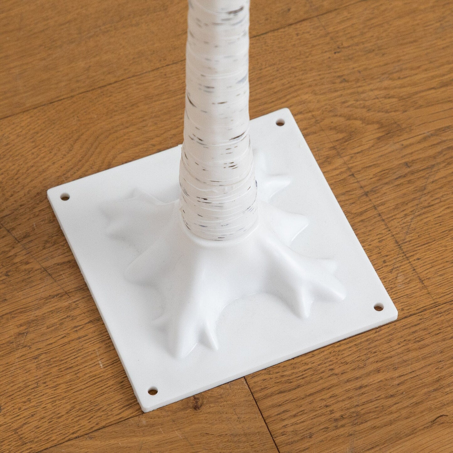 Tree with white birch twig trunk on a square white base on Tampa Home & Garden Store