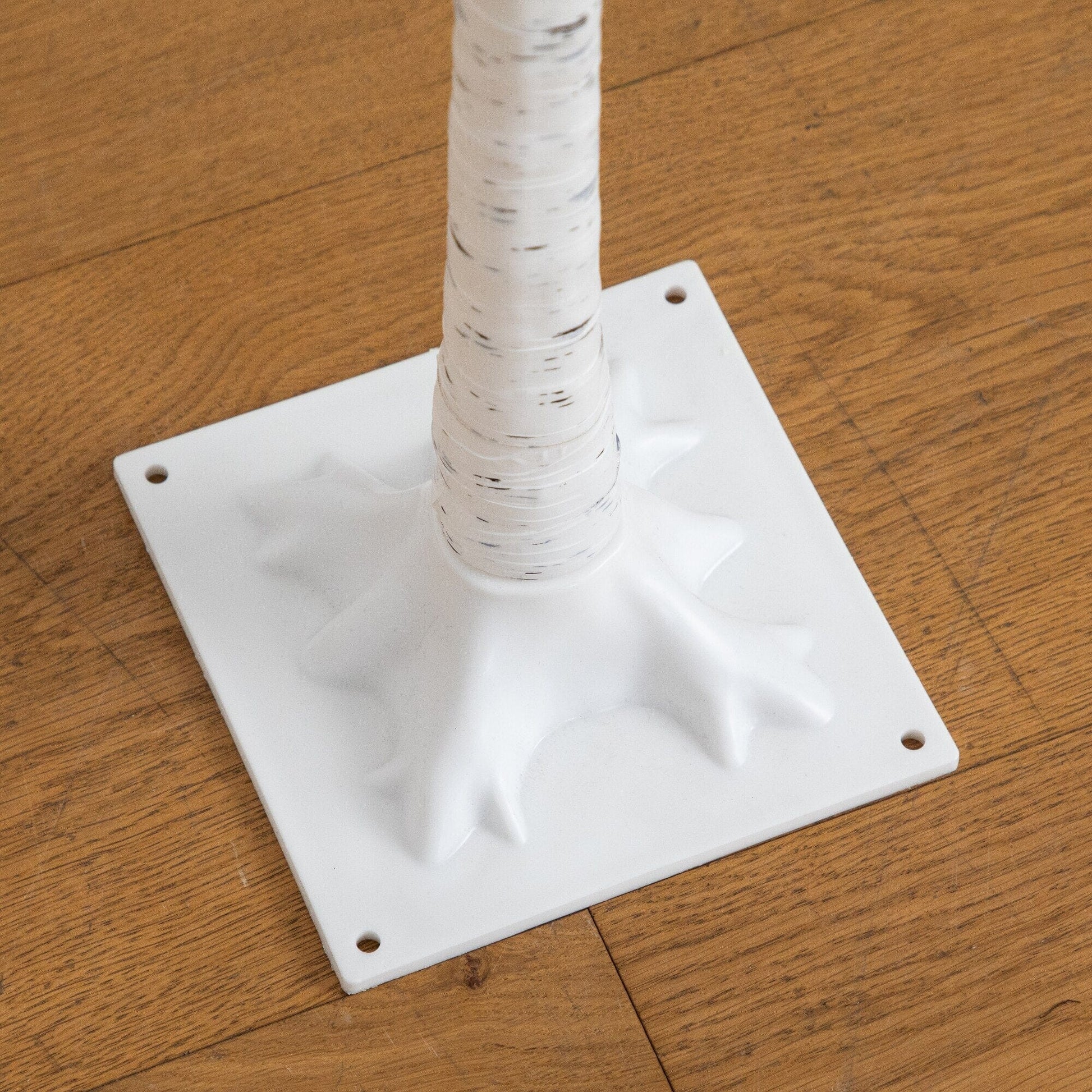 Tree with white birch twig trunk on a square white base on Tampa Home & Garden Store