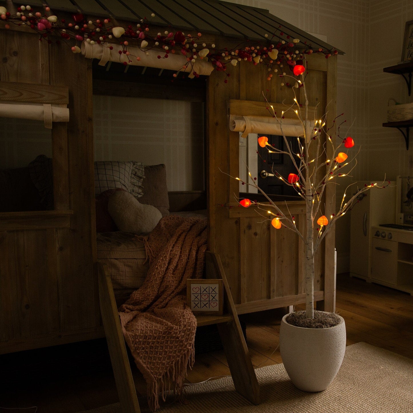 4 ft pre-lit Valentine twig tree with 48 heart LED lights and red berries in white planter on Tampa Home & Garden Store