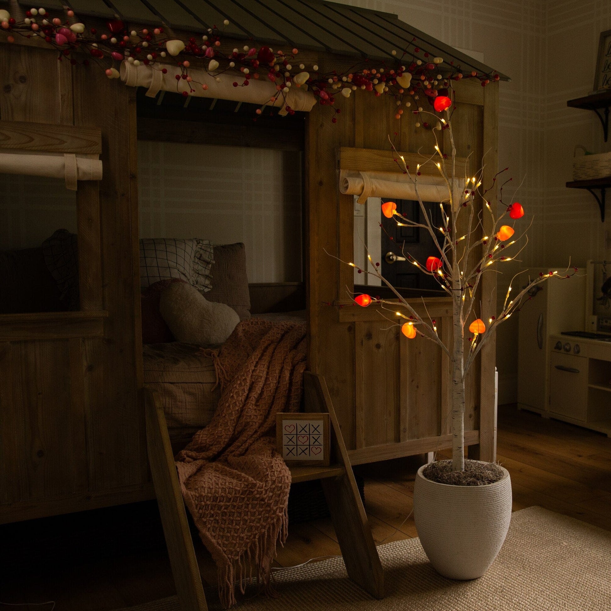 4 ft pre-lit Valentine twig tree with 48 heart LED lights and red berries in white planter on Tampa Home & Garden Store