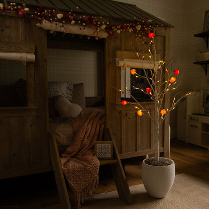 4 ft pre-lit Valentine twig tree with 48 heart LED lights and red berries in white planter on Tampa Home & Garden Store