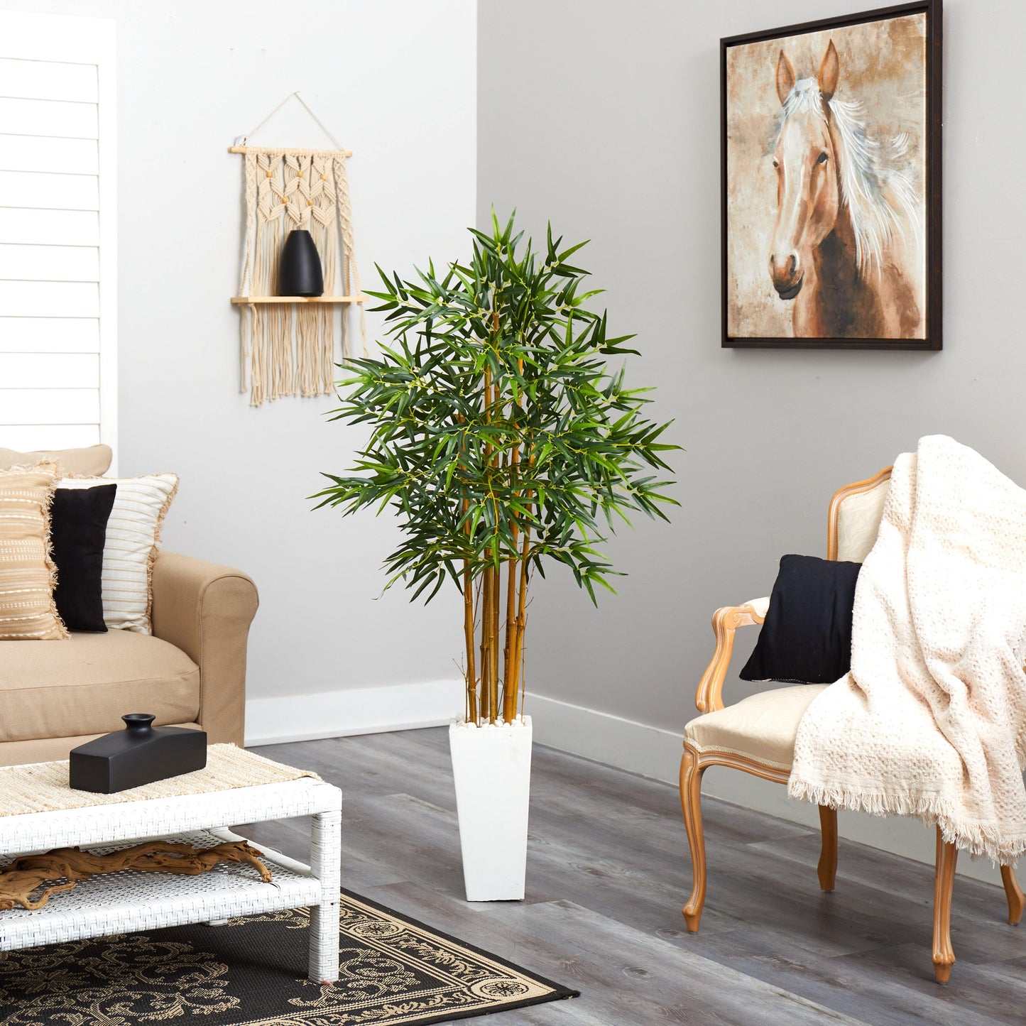 5’ bamboo tree in a white tower planter with green foliage in a modern living room on Tampa Home & Garden Store