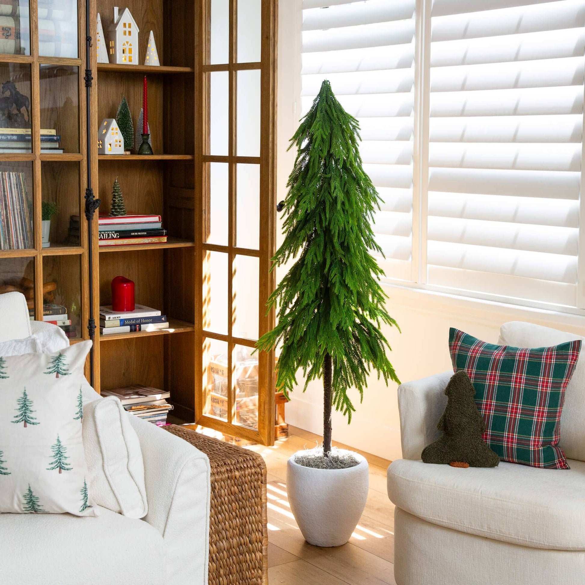 5' artificial Norfolk pine tree with real-touch, down-swept branches in green, in a white pot on Tampa Home & Garden Store