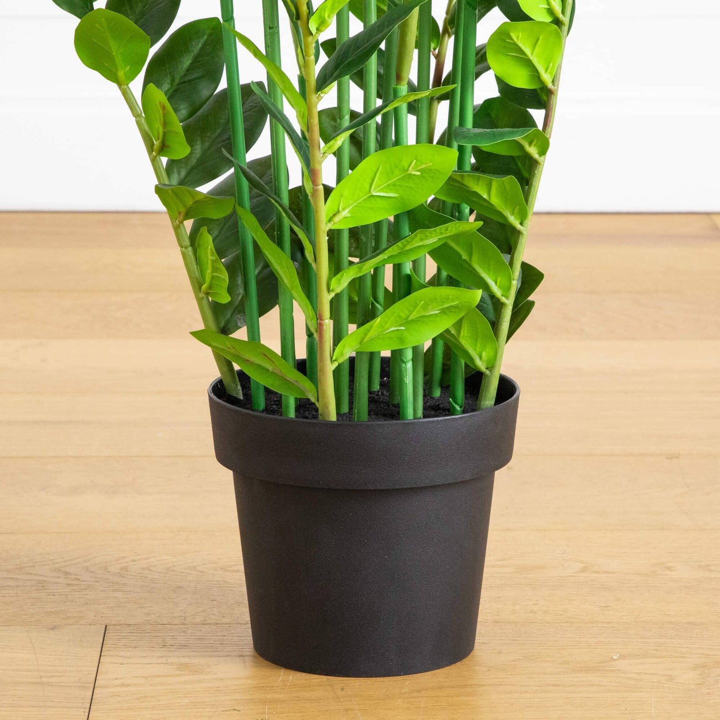 Artificial Zamioculcas plant, 5 ft tall, Nearly Natural, lush green leaves in a black pot on Tampa Home & Garden Store