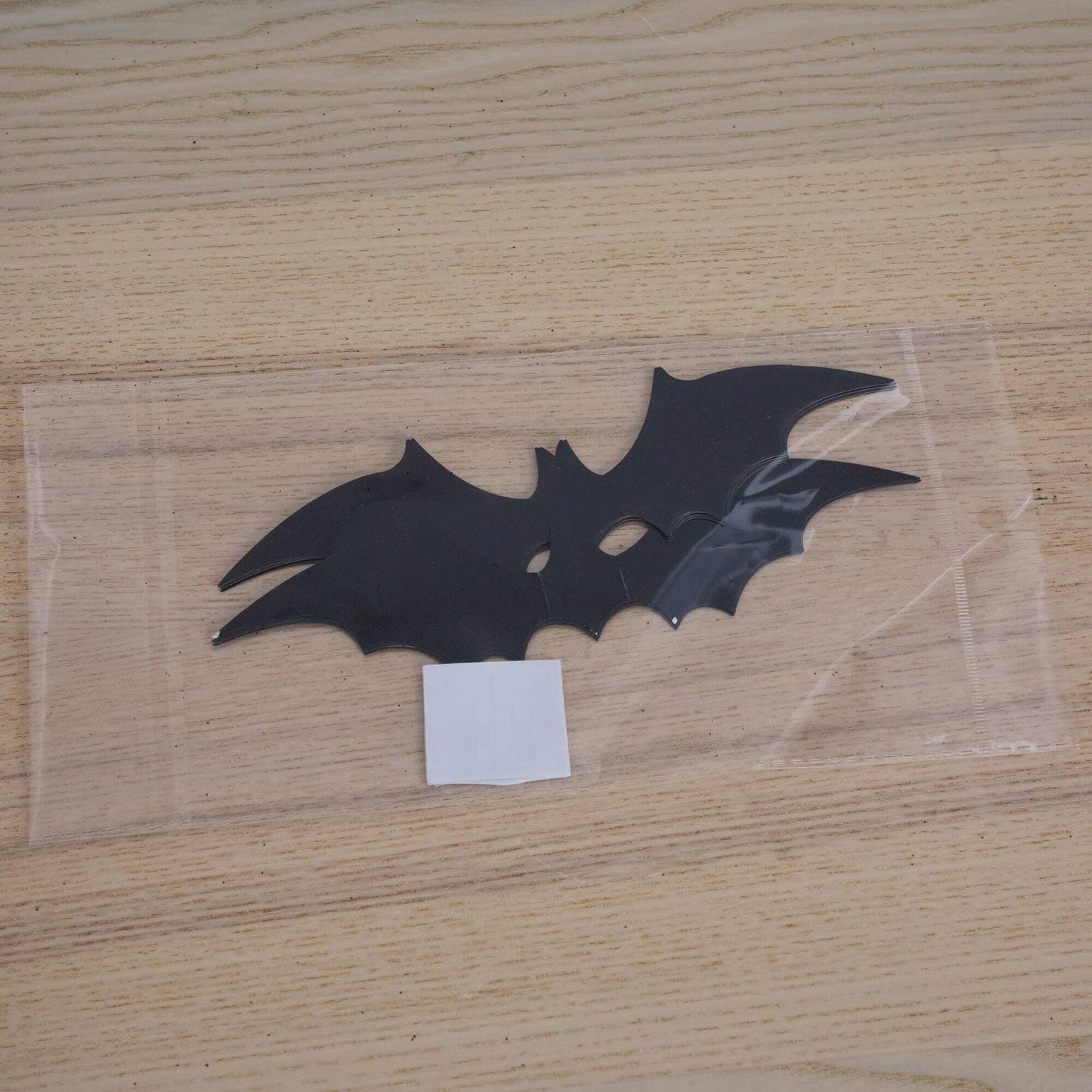 Bat silhouette Halloween decorations in black on a wooden surface on Tampa Home & Garden Store