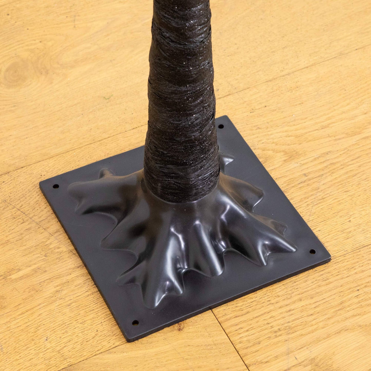 Artificial Halloween Black Twig Tree trunk with glitter specks on a square gray base on Tampa Home & Garden Store