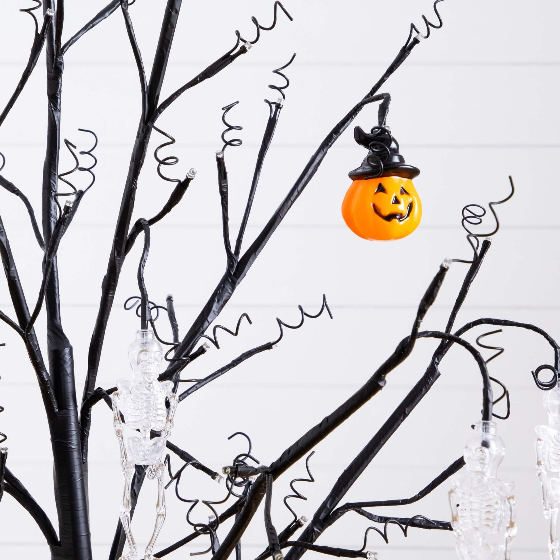 5' Nearly Natural Halloween ornament tree with black branches, pumpkins & skulls, 72 LEDs on Tampa Home & Garden Store