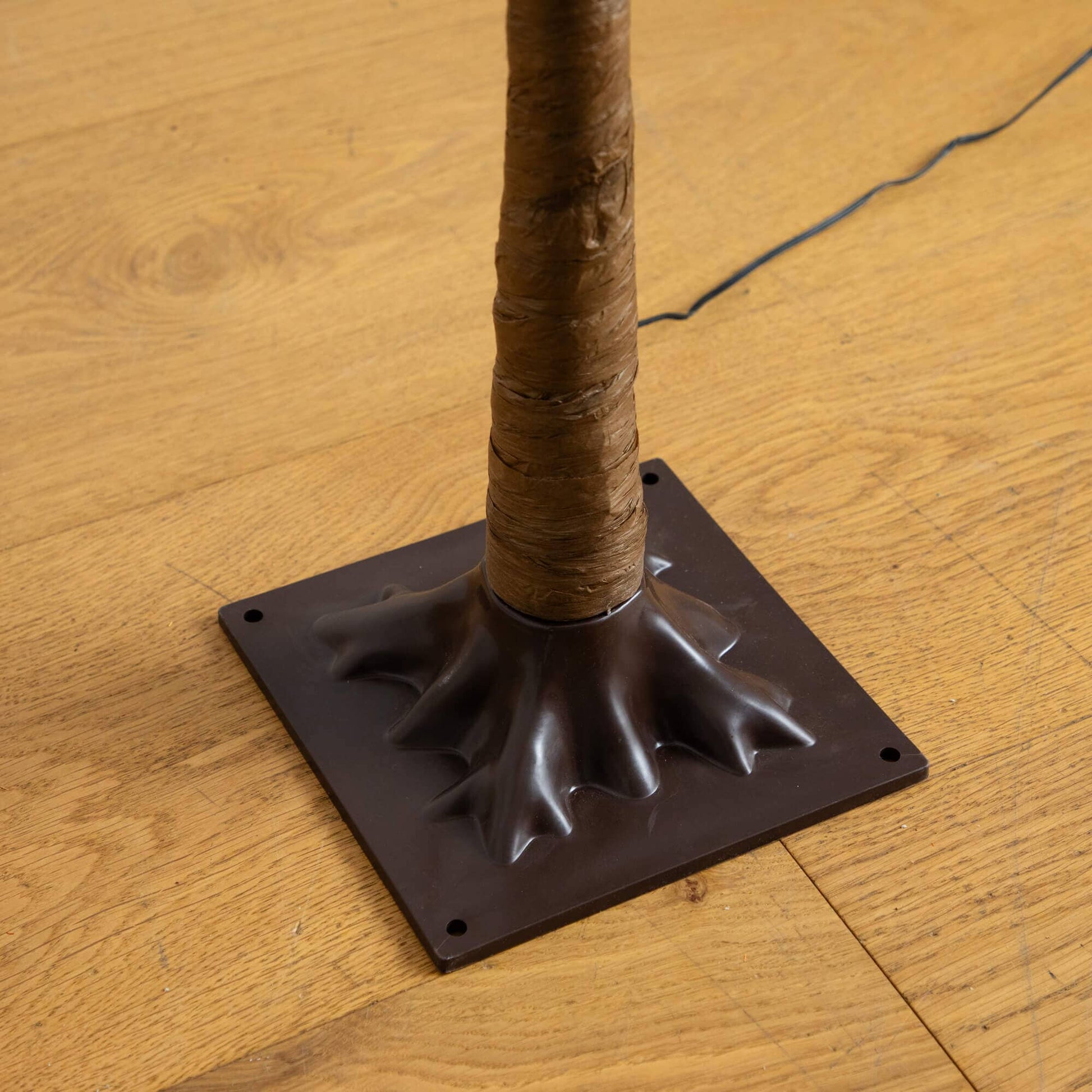 5' burnt orange maple artificial tree trunk with wrap and black base; power cord visible on Tampa Home & Garden Store