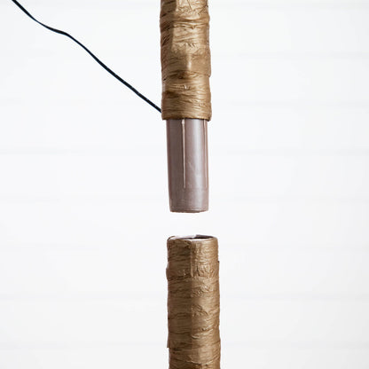 5 ft pre-lit artificial tree trunk close-up with brown wrapping and visible wire on Tampa Home & Garden Store