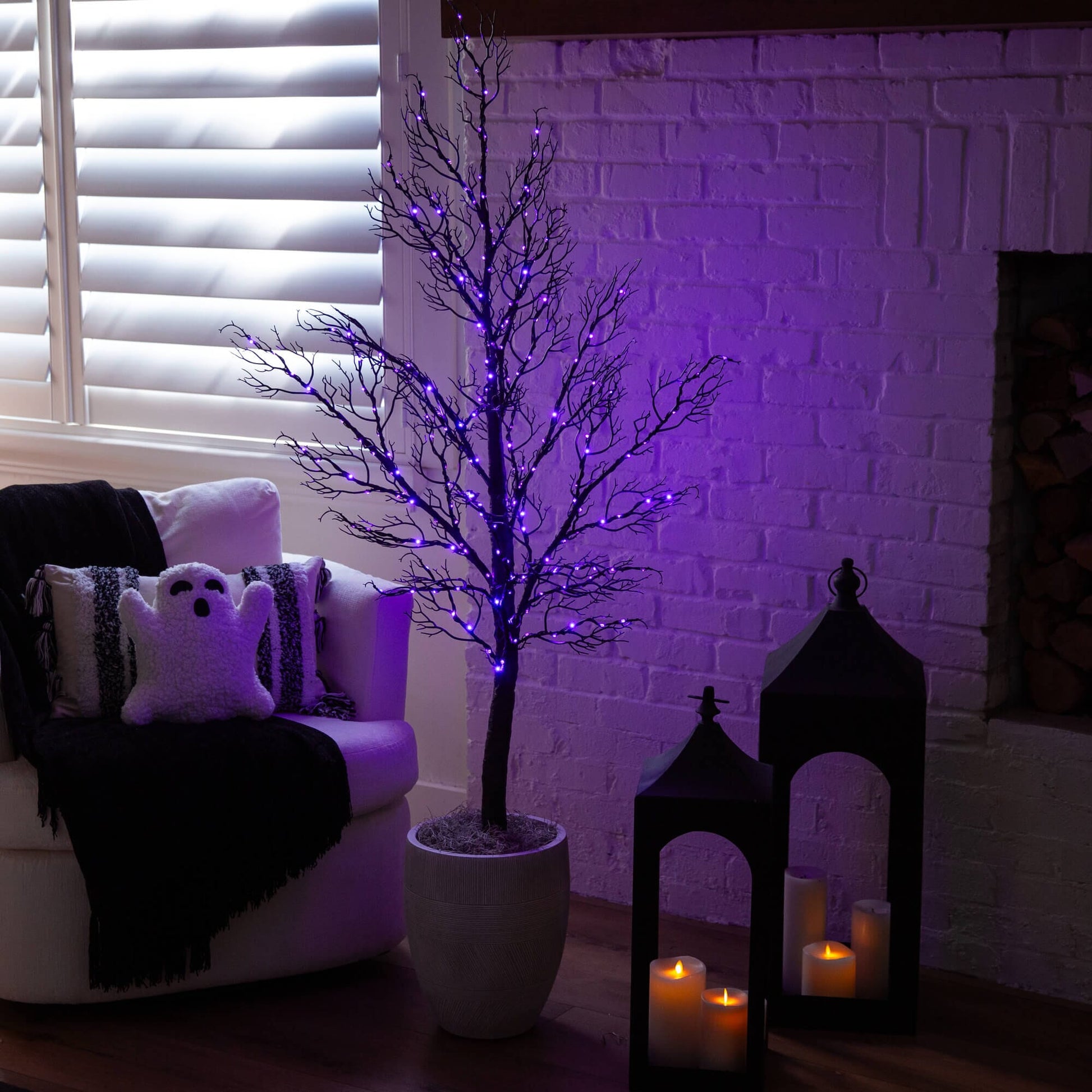 5 ft pre-lit Halloween minimalist twig tree with 240 orange and purple LED lights in a pot by Nearly Natural on Tampa Home & Garden Store