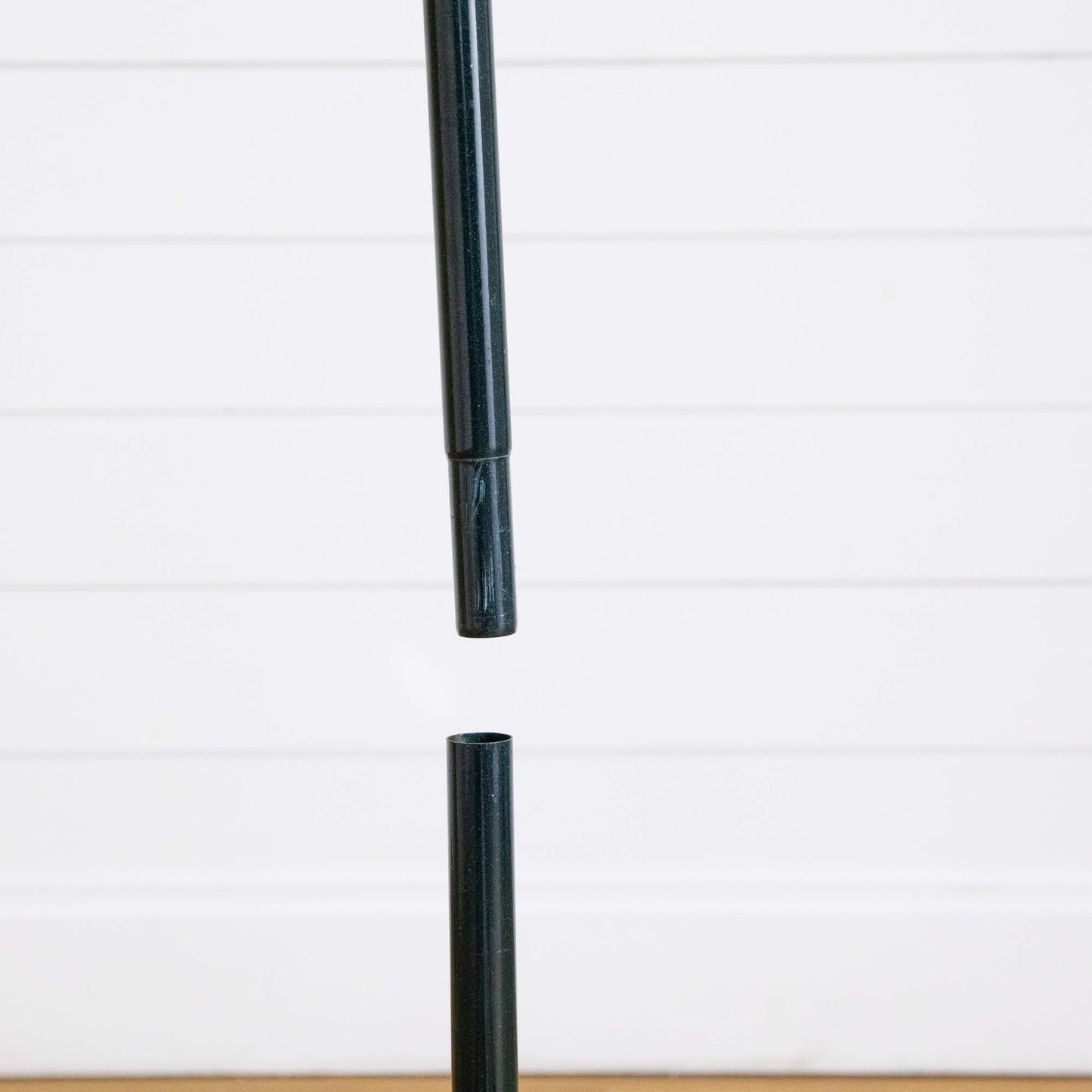 5 ft Christmas tree pole segment, dark green telescoping shaft against white panel backdrop on Tampa Home & Garden Store