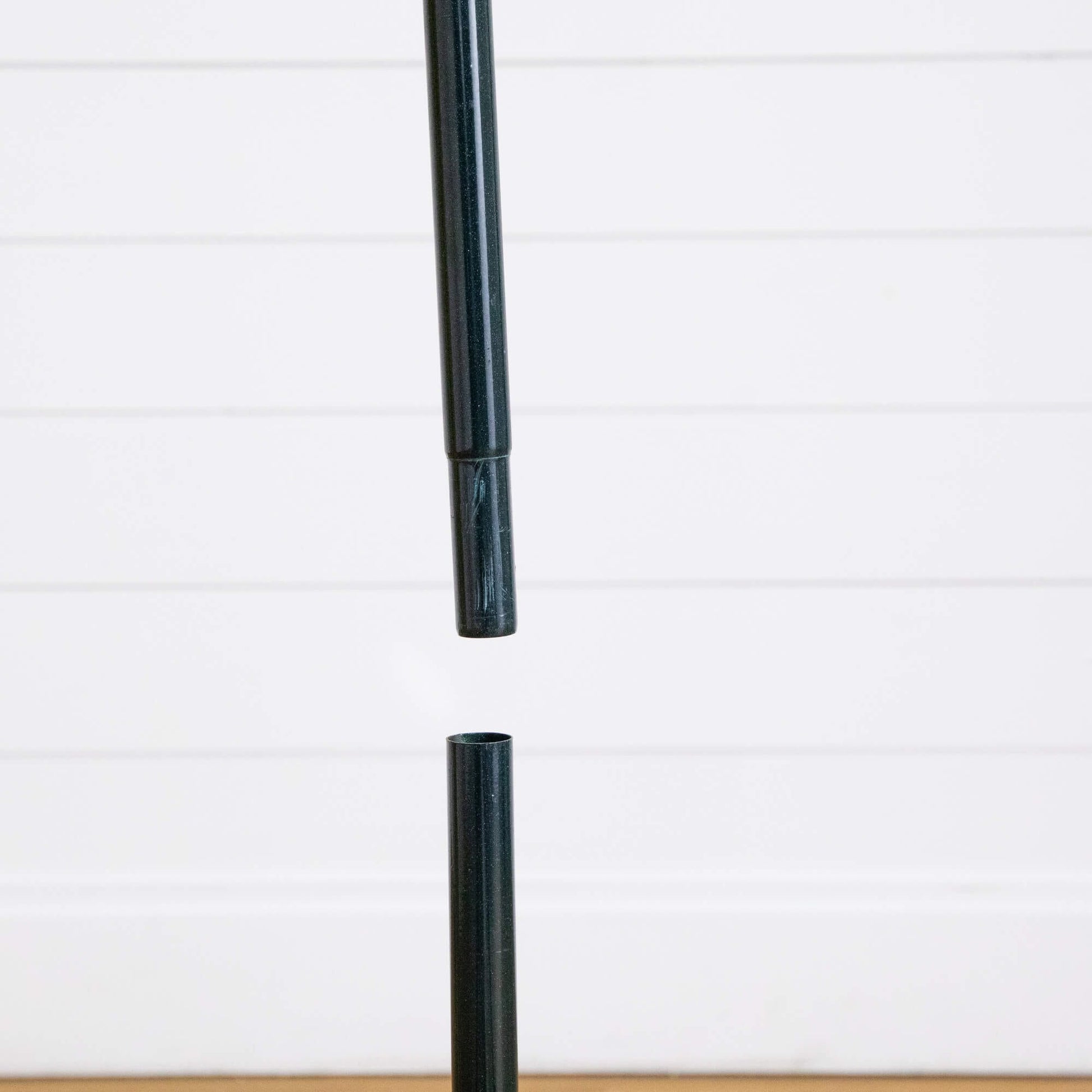 5 ft Christmas tree pole segment, dark green telescoping shaft against white panel backdrop on Tampa Home & Garden Store