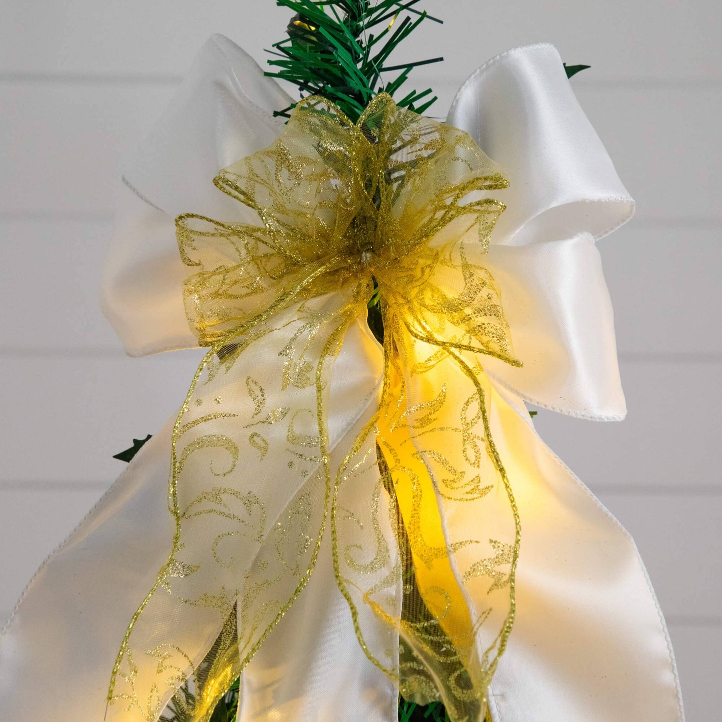 Nearly Natural 5 ft pre-lit pop-up Christmas tree wrapped in white satin with gold glitter ribbon bow on Tampa Home & Garden Store