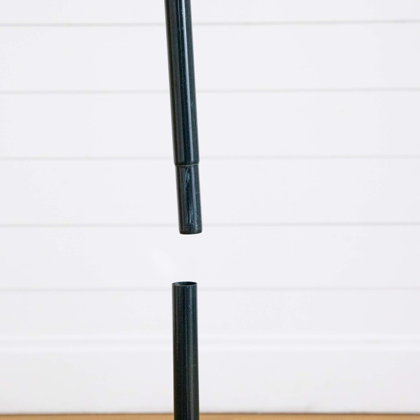 Black metal tree stand pole for a Nearly Natural 5 ft pre-lit Christmas tree on Tampa Home & Garden Store